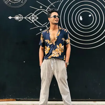 A candid shot from a photoshoot. My personal style is a big part of my identity as a creative artist.