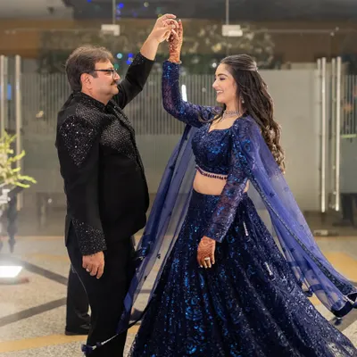 A father-daughter dance is a precious memory. My flowing, sequined blue lehenga was designed for movement, allowing me to twirl and dance comfortably all night long.