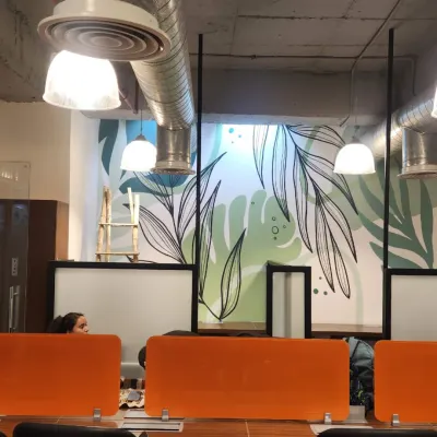 A minimalist botanical doodle art mural designed for a modern workspace. The clean lines and soothing green tones bring a sense of calm and nature into the office environment.