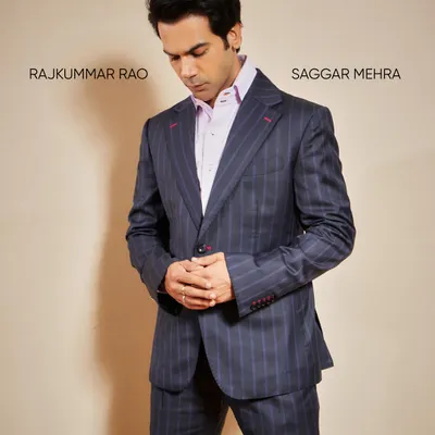 A contemplative moment with Rajkummar Rao in my tailored pinstripe suit. This angle shows the structure of the shoulders and the clean lines of the lapel, key elements of classic bespoke tailoring.