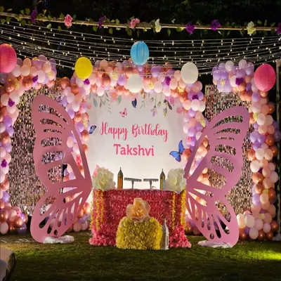 Planning your little one's first birthday? We created this magical butterfly wonderland for Takshvi's big day, complete with giant pink butterfly wings for the perfect photo op, a sparkling cake table, and a dreamy balloon arch with fairy lights. We love making first birthdays unforgettable.