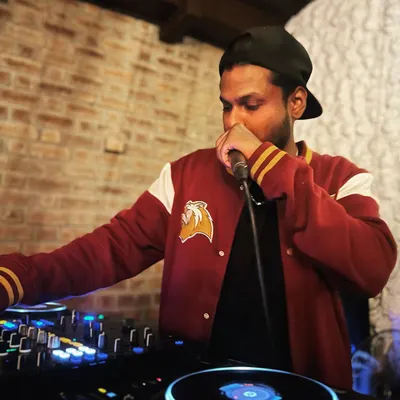 Grabbing the mic at Watson's. I'm not afraid to step up and be the master of ceremonies, guiding the energy of the party throughout the night.