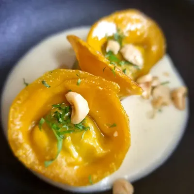 Our artisanal, handmade butternut squash and truffle ravioli. We received a message from a client saying we "out-did" ourselves with this "insanely magical" dish, which is the best compliment we could ask for.
