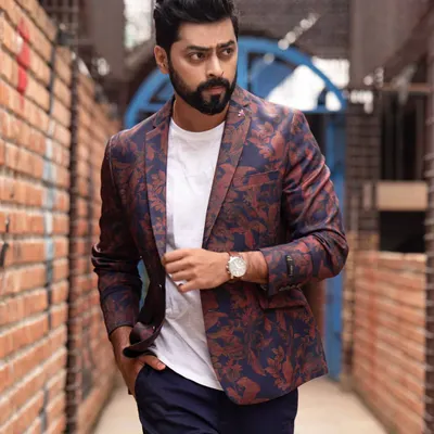 A powerful walking shot of Tarak Ponnappa from his portfolio session. The narrow brick alleyway and his confident stride create a dynamic and cinematic feel, perfect for an actor's lookbook.