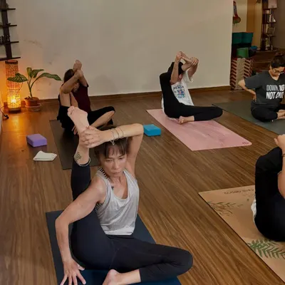 A student in Krounchasana (Heron Pose) during a self-paced class. The community at the shala is inspiring, with everyone working at their own level.