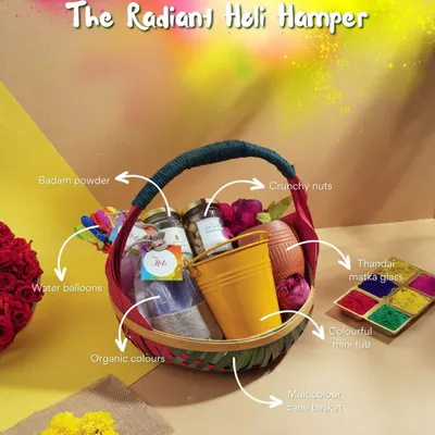 Our "Radiant Holi Hamper" has everything you need for a vibrant celebration. It includes organic colours, crunchy nuts, badam powder for thandai, and even water balloons, all in a beautiful handwoven basket.