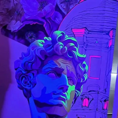 Art that transforms with the light. This mural at 'Raahi' restaurant has a hidden layer of fluorescent paint that comes alive under UV light, creating a surprising and magical experience for evening guests.