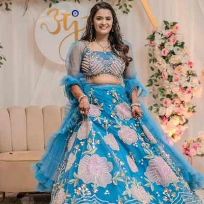 Engagement is all about new beginnings and butterflies. Jinal looked heavenly in this beautiful blue floral lehenga, and we gave her a soft, glowing makeup look to match. 🦋✨