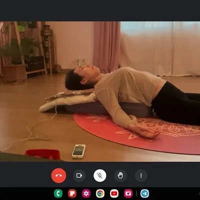 An online private session focusing on posture correction. Even remotely, I can guide you through poses like this supported backbend in Matsyasana (Fish Pose) to help you become more aware of your body's alignment and release tension.