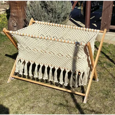 This is our wooden baby swing, designed for your baby's comfort and safety. It's a beautiful, traditional piece, handmade with soft cotton rope. As manufacturers, we offer it at half the price of other sellers.