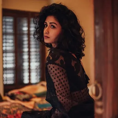 Another angle from my shoot with actress Chitrangada Chakraborty. This shot highlights the soft, textured curls and the makeup's seamless blend in natural, diffused light, showcasing a look that is both striking and subtle.
