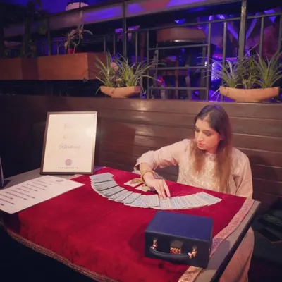 Focused and ready for a client at a Valentine's event. I am available for private events and gatherings, offering a unique and insightful experience for your guests.