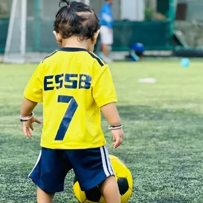 Big dreams start with small kicks. Here, one of our youngest players, just 3 years old, gets familiar with the football. Our toddler program is all about creating a positive first experience with the sport.