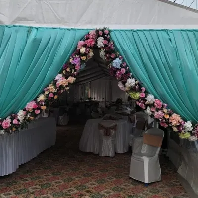 We were thrilled to design the entrance for Columbia Sportswear's office opening. The floral arch and elegant draping in the brand's colors created a welcoming and professional ambiance for the corporate event.