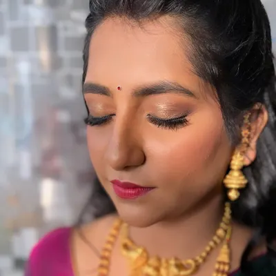 This is a perfect example of a 'no-makeup' makeup look. For her engagement, she wanted something very subtle, so I focused on creating a flawless, glowing base with minimal eye makeup and a natural lip tint.