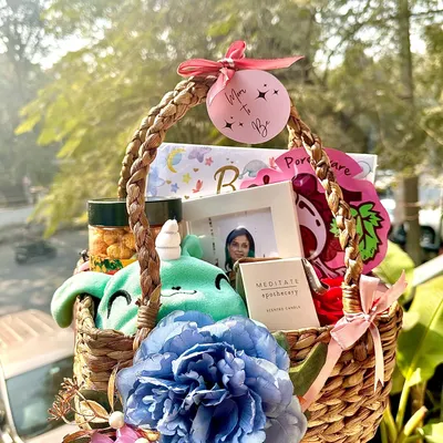 Our most loved "Mom to Be" Basket of Love. This hamper includes a cute soft toy, a baby record book, a soothing scented candle, and a photo frame to capture the special moments.