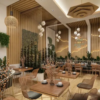 To create a warm and organic atmosphere for this cafe, we used an abundance of natural materials. The design features bamboo-style wall paneling, hanging plants, and intricate pendant lighting to craft a welcoming and highly photogenic environment for guests.