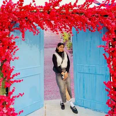 Winter style is all about cozy layers. Here, I've paired a denim midi skirt with a black turtleneck and a cream sweater vest. The chunky loafers and socks add a trendy, academic touch to the look.