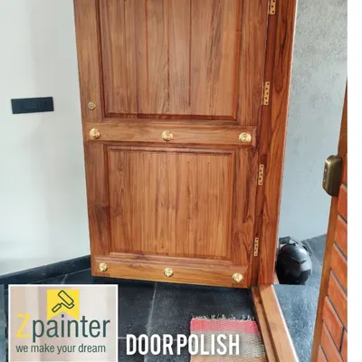 A classic teak wood door treated with a clear polish to showcase its natural beauty and texture. This finish protects the wood while maintaining its original, elegant appearance.