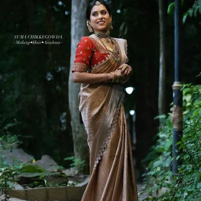 A full-length portrait of a timeless Muhurtham look, showcasing the elegant fall of the Kanjivaram saree and the overall poise of the bride.