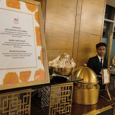A glimpse of the menu at one of my chaat counters, featuring creative items like 'Deconstructed Dabeli' and 'Babycorn Cigar' alongside classic favorites.