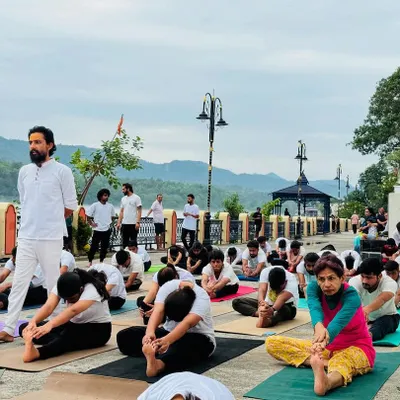 Practicing yoga outdoors connects us to the elements. Here, our students are in Janu Sirsasana during a special outdoor session.
