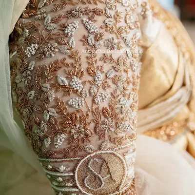 A truly personal touch for the bride. We embroidered her and her partner's initials 'S' and 'A' onto the cuff of her bridal blouse sleeve, making it a beautiful and intimate detail.