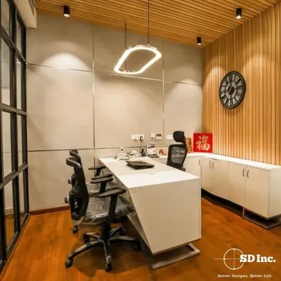 A modern executive cabin designed for focus, featuring a minimalist desk, wood-paneled accent wall, and integrated storage. The layout and lighting are optimized for a professional and productive atmosphere.