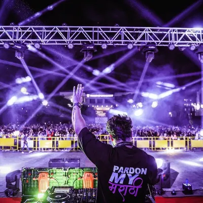 Waving to the massive crowd at the SGU Kolhapur campus fest. The energy from thousands of students singing and dancing along is why I do this. It's a blessing.