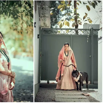 A bride looking radiant in her wedding lehenga, holding the leash of her dapper dog. We make sure your four-legged family members are part of your most important portraits.