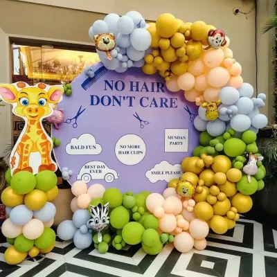 This "No Hair Don't Care" backdrop is a client favorite for mundan parties. The fun phrases, cute graphics, and colorful balloon garland make for fantastic photos.