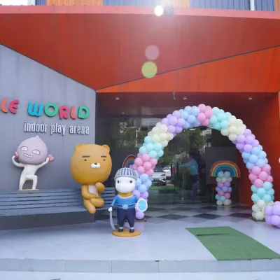 The grand entrance to Wobble World, decorated with a pastel balloon arch for a special event. Our fun character statues welcome you to a world of play from the moment you arrive.