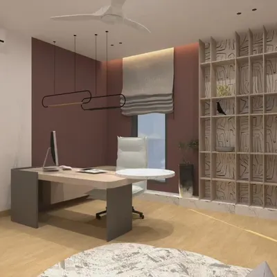 This home office is designed to be both inviting and functional. The custom-designed bookshelf is a piece of art in itself, providing ample storage while creating a unique visual feature. The warm accent wall and modern lighting make it a great space for focused work.