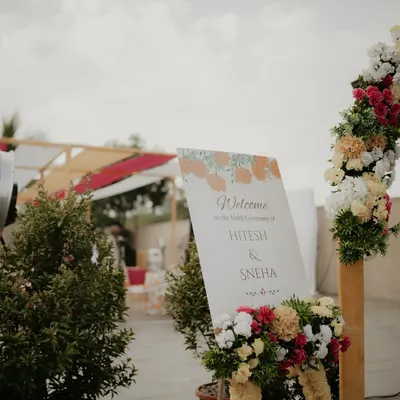 The welcome sign that greets your guests, adorned with flowers, setting the tone for the celebration to come.