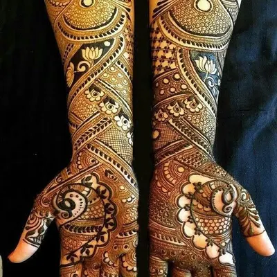 A classic full bridal design featuring a beautiful mix of paisleys, florals, and intricate line work, creating a rich and traditional look.