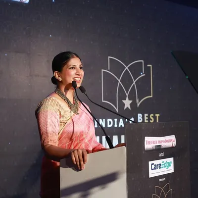 A smile of confidence while hosting India's Best Annual Report Awards. I ensure the script is delivered with clarity and warmth, keeping the evening's proceedings running smoothly for all the esteemed guests.