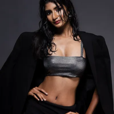 A model with the signature "wet look" in a silver checkered top and black blazer. This high-fashion, edgy style is one of my specialties and is perfect for magazine editorials.