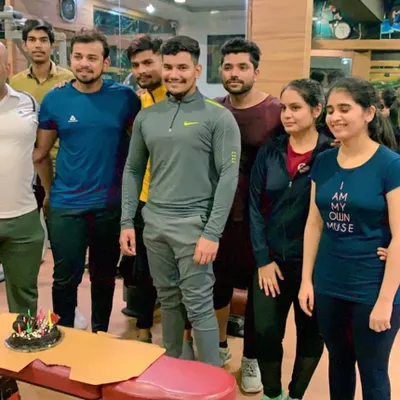 Celebrating one of our trainer's birthdays with the gym members. This is the community spirit we foster at Fit X Gym. We work hard and celebrate together.
