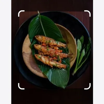 This is fish prepared in the Naga style, served on a banana leaf. The presentation is as traditional as the recipe, which uses local herbs and spices.