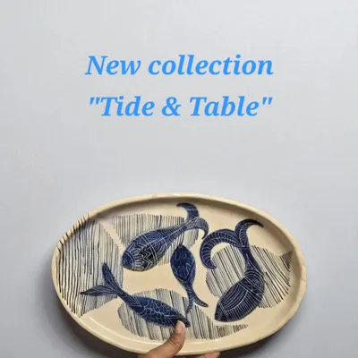 Introducing the "Tide & Table" collection, inspired by the ocean's rhythm. This hand-constructed and painted fish platter is a limited edition piece, designed to bring coastal elegance to your dining experience.