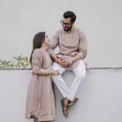 Dressed in beautiful traditional attire, this couple shares a look filled with promises for the future. This is a perfect example of an elegant pre-wedding portrait that feels both classic and personal.