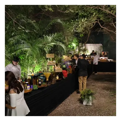 An overview of our buffet setup at the Garden of Five Senses. This image shows our team in the background, diligently working to ensure the food is perfectly presented and replenished throughout the event.