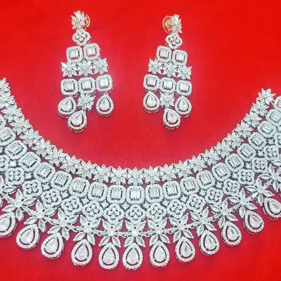 This rhodium-plated American Diamond necklace set is a showstopper. The intricate design and brilliant sparkle make it the perfect accessory for a glamorous sangeet or reception night.
