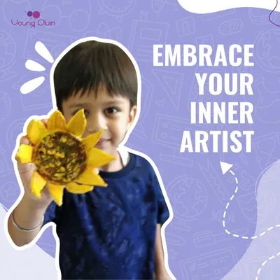 Embrace your inner artist. This young creator is proudly holding up his handmade sunflower, a perfect example of the simple, joyful art we encourage in our creative learning center.