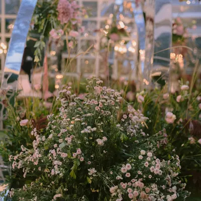 A close-up of the dreamy fresh florals surrounding the contemporary mirrored mandap we designed. Every flower is intentionally placed to create a soft, romantic, and immersive garden feel.