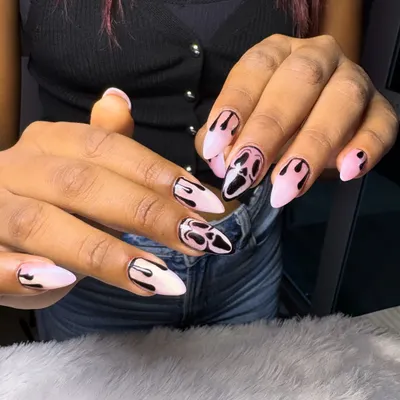 Spooky season calls for spooky nails. This Halloween set features the iconic Ghostface mask and dripping blood details on a pale pink base for a look that's both creepy and chic.