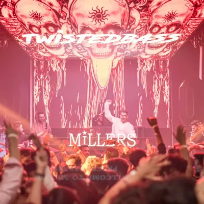 A shot from my perspective at Millers, Pune, with my 'TwistedBass' branding lighting up the incredible LED visuals behind me. The production was just as wild as the crowd.