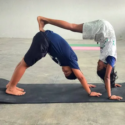 Flexibility, fun, and friendship. Our young swimmers celebrate International Yoga Day with impressive acro yoga poses, building strength and trust together.