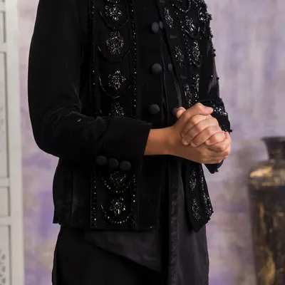 A detailed close up of the black velvet Indo-western jacket. You can see the intricate black on black beadwork and embroidery that I use to create a rich, textured look.