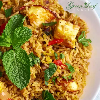 My Paneer Biryani is a fragrant and flavorful centerpiece for any main course. It's cooked with long-grain basmati rice, aromatic spices, and soft paneer, garnished with fresh mint.